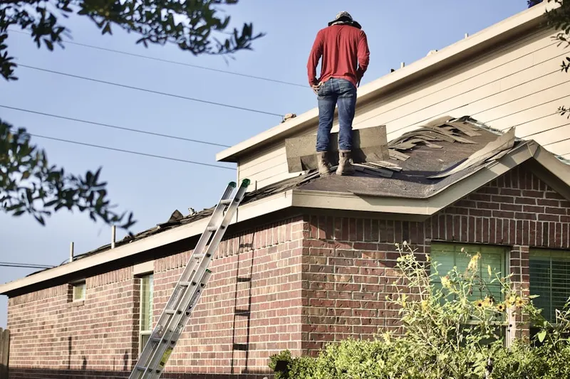 Professional roofer working on a residential roof in Schaefferstown